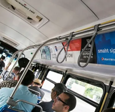 14. An placard advertisement inside a bus in SoCal